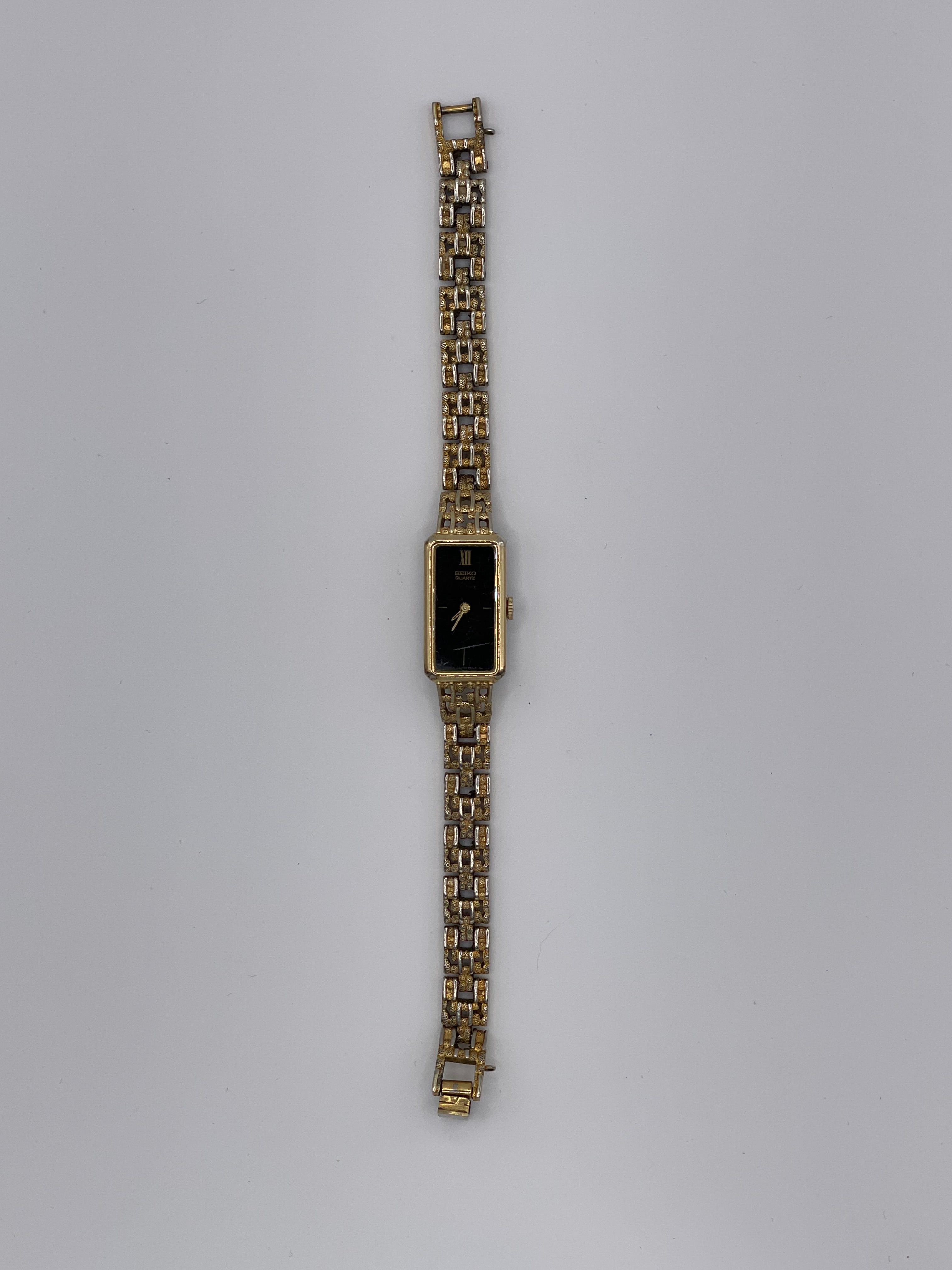 Vintage Seiko Quartz Rectangular Gold-Tone Women’s Watch – Black Dial (Ref. 1320-5249) - Pre-Owned